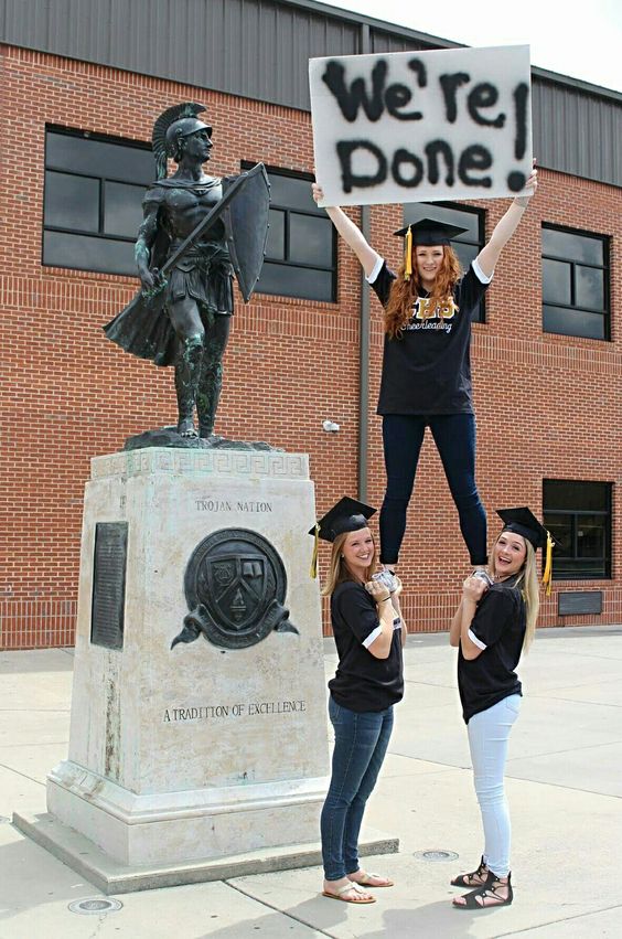 graduation pictures holding sign
