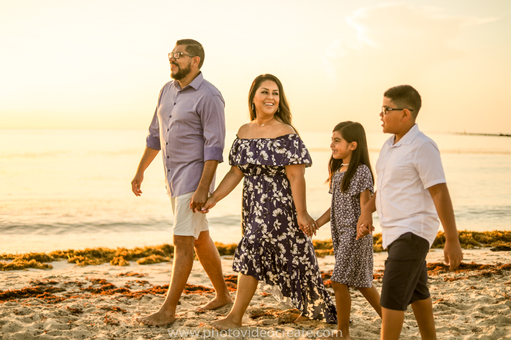 Premium AI Image | a family poses for a photo on the beach.