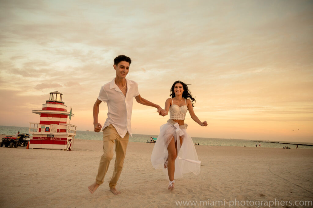 Romantic couple captured during a sunset honeymoon photoshoot on Miami Beach, professionally photographed.