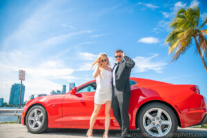 Miami Elopement Destination Wedding Photographer 3 Bride and groom walking hand in hand along the beach during their Miami elopement, professionally photographed.